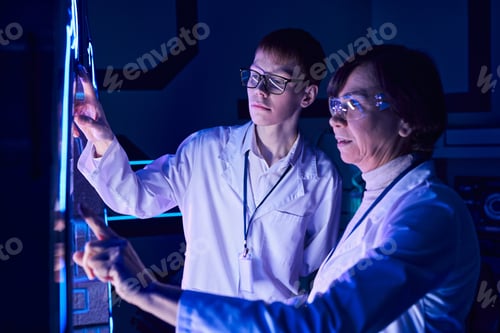 Preview: science of future, woman scientist and young intern operation innovative device in discovery center