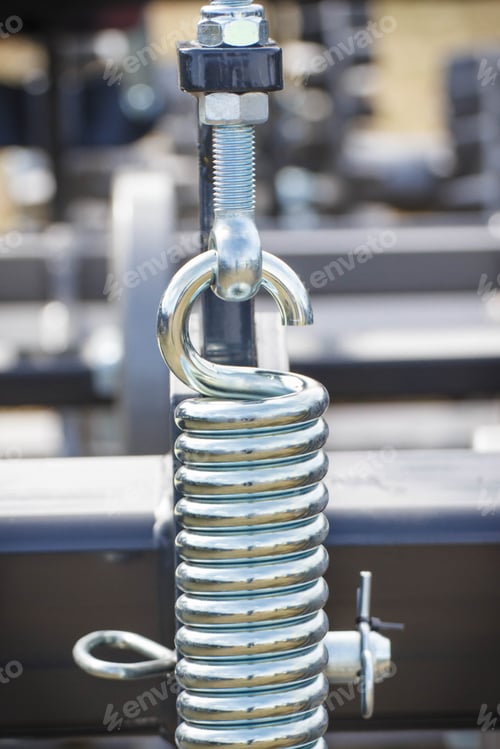 Preview: Hard silver spring made of steel. Part and detail of industrial or agricultural machine