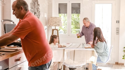 Preview: Family Preparing Food Together in a Bright Kitchen