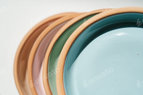 Preview: A stack of ceramic cups in pastel colors.