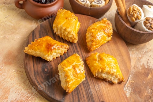 Preview: front view yummy nut cakes with confitures on wooden desk sweet pastry biscuit cake