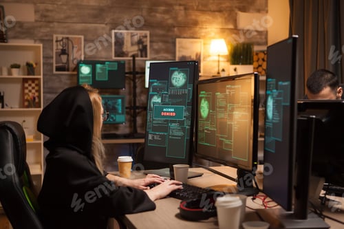 Preview: Side view of female hacker wearing a hoodie