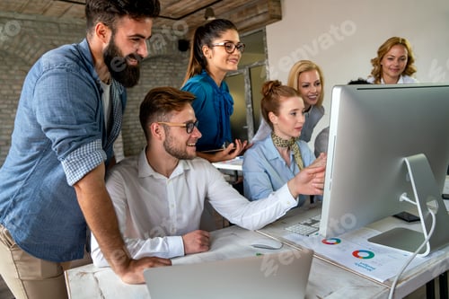 Preview: Programmers cooperating at IT company developing apps. Business people technology concept