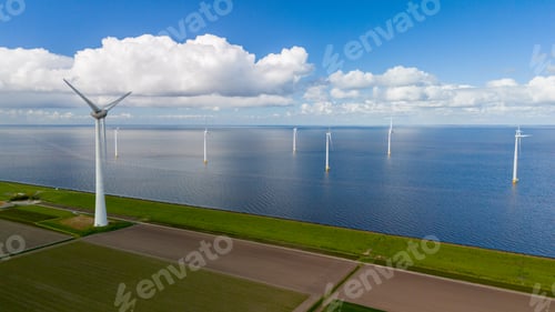 Preview: Breezy Day at Windmill Park Overlooking Tranquil Waters in the Netherlands