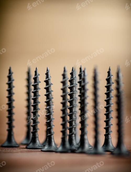 Preview: Self-tapping screw on wood on the table.