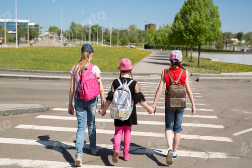 Preview: Schoolchildren crossing the road on their way to school
