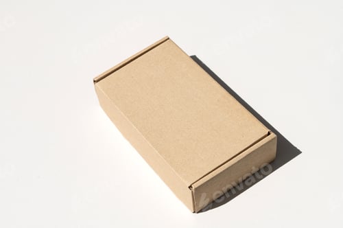Preview: Rectangular closed box made of corrugated cardboard on a white background