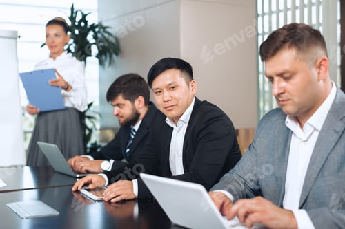 Preview: Meeting with professionals in a modern office setting during a team presentation session