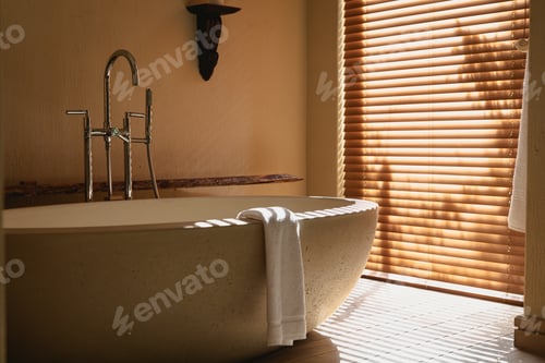 Preview: Interior of sunny, modern bathroom with beautiful designer bath
