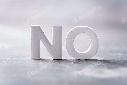 Preview: Word NO made with cement letters on grey marble background. Copy space. Business concept