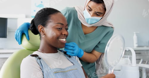 Preview: Happy woman, dentist and patient with mirror for dental care, teeth cleaning or treatment at clinic