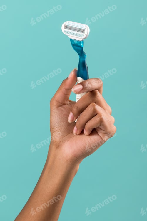 Preview: Crop woman with razor in hand