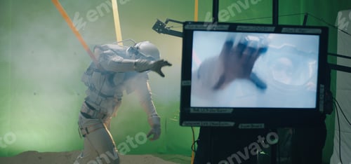 Preview: Medium Shot Of The Shooting Of A Scene With An Astronaut Struggling Against The Wind