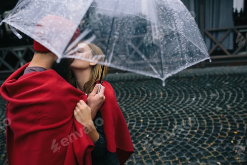 Preview: guy and girl under an umbrella