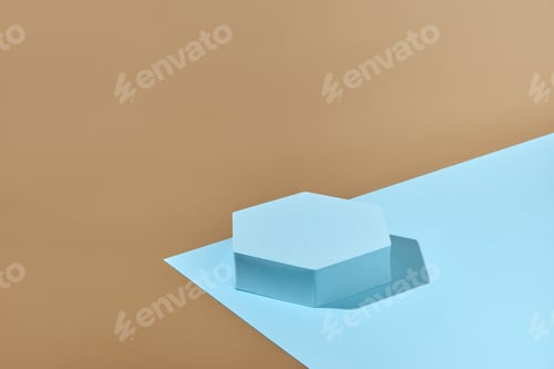 Preview: Hexagonal podium on blue and beige background. Backdrop for product display.