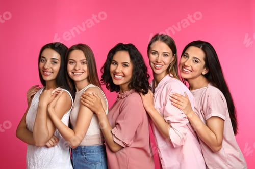 Preview: Happy women on pink background. Girl power concept