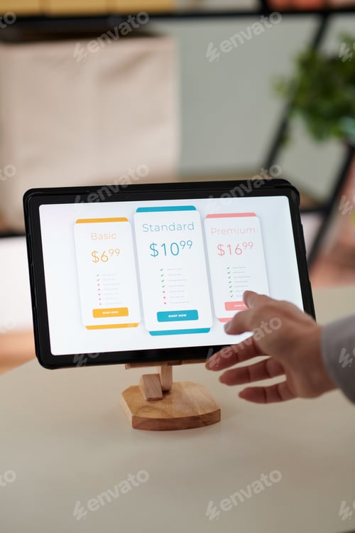 Preview: Hand of young female shopper choosing smartphone in online shop