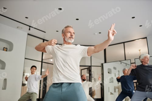 Preview: Elderly People Doing Qigong Exercise in Gym
