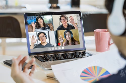 Preview: Rear View of Asian Business man say hello with teamwork colleague in video conference