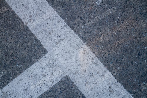 Preview: Close up of street line on grainy asphalt.
