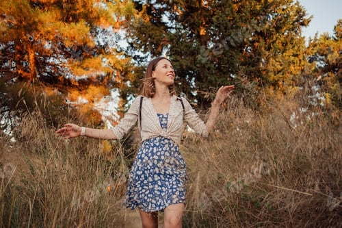 Preview: Smiling woman traveler exploring beautiful natural sites