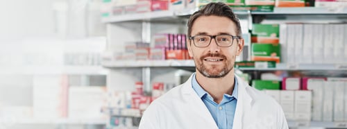Preview: Smile, portrait and mature man in pharmacy with healthcare, drugs and banner space in medicine stor