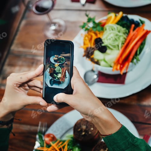 Preview: Girl Photographing Food In A Restaurant