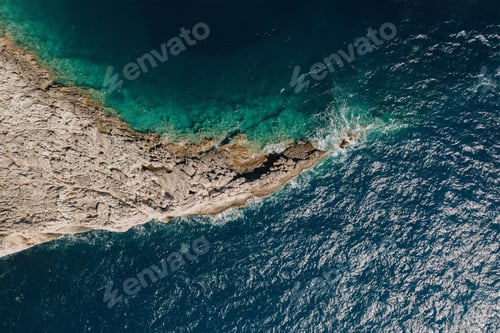 Preview: Aerial view over rocks landscape and blue sea in Greece