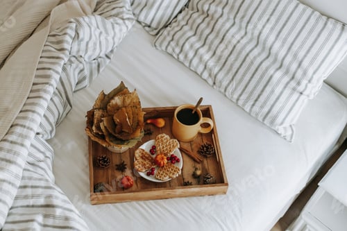 Preview: Wooden tray with breakfast in bed.
