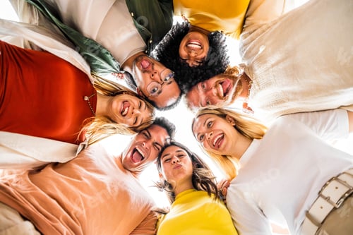 Preview: Multicultural friends smiling together at camera