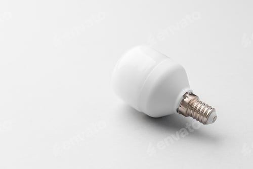 Preview: Light bulb on light grey paper background