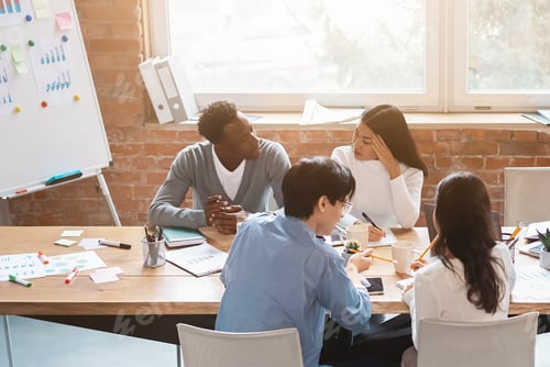 Preview: Business meeting of young creative people, office interior