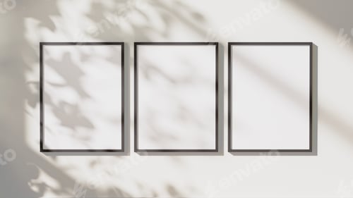 Preview: empty black vertical rectangular frames mock up with leaves shadows and sunlight on white wall