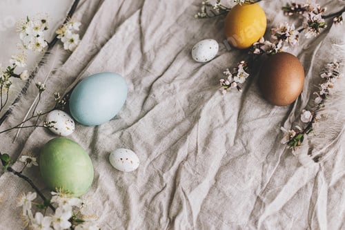 Preview: Happy Easter! Stylish Easter eggs and cherry blossoms on rustic linen cloth