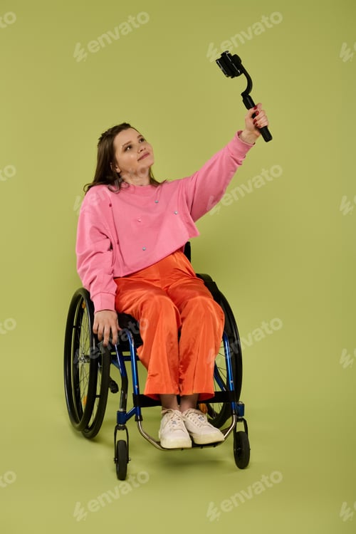 Preview: Brunette woman in wheelchair takes a selfie