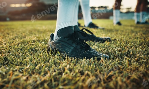 Preview: Cropped shot of an unrecognizable group of rugby players training on the field during the day
