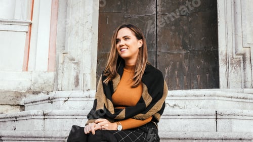 Preview: Stylish Woman Posing on Steps Near Building