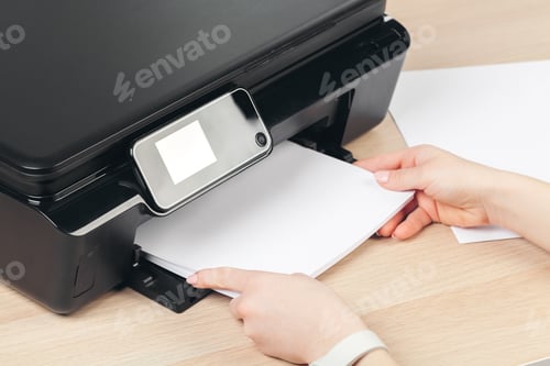 Preview: Woman making photocopy using copier in office