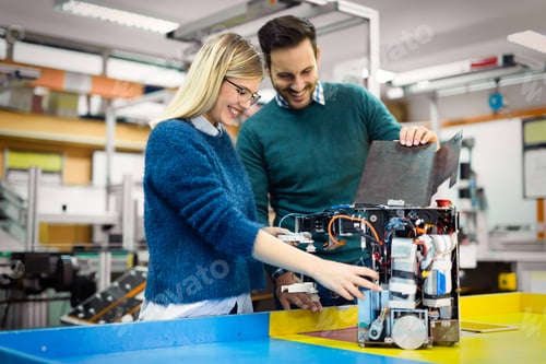 Preview: Young attractive students of mechatronics working on project