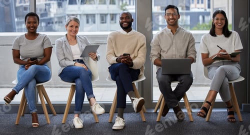 Preview: Shot of a group of businesspeople using wireless devices while waiting in line for an interview