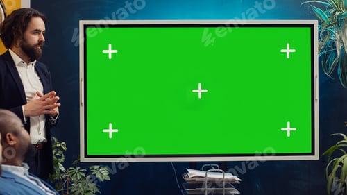 Preview: Startup team using greenscreen interactive board in a strategy workshop meeting