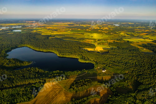 Preview: Top view of Bolta lake in the forest in the Braslav lakes National Park at dawn, the most beautiful