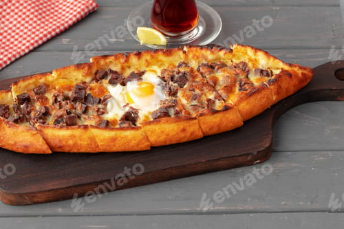 Preview: Close up of Turkish Pide bread on wooden table