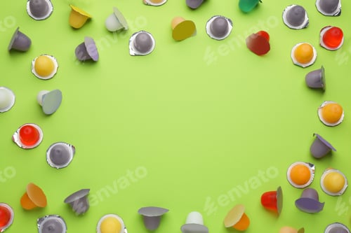 Preview: Frame of tasty bright jelly cups on green background, flat lay. Space for text