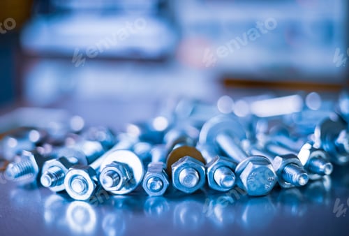 Preview: Metal chrome bolts and nuts in a chaotic order industrial background