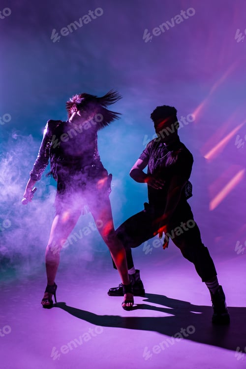 Preview: Sensual young dancers near smoke