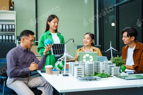 Preview: Colleagues meet at desk brainstorm environmental management strategies. discuss carbon emissions