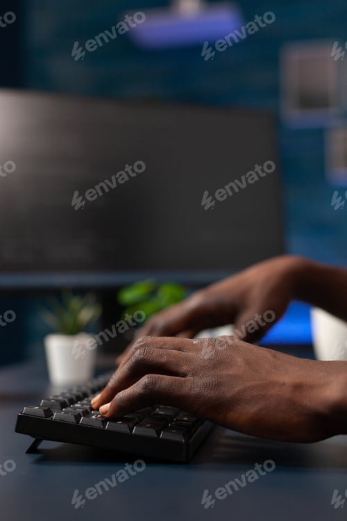 Preview: Closeup of developer man hand writing program codes on computer