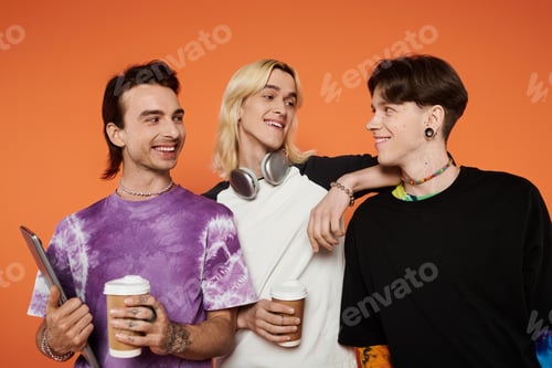 Preview: Queer friends laughing together on a vibrant orange background