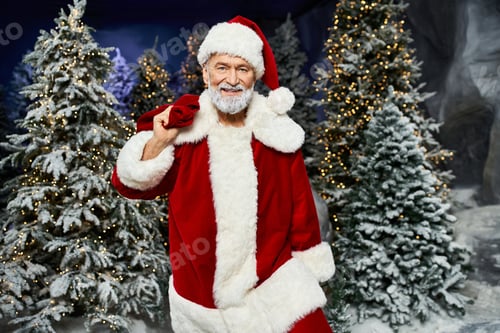 Preview: Santa Claus spreading joy amidst a winter wonderland of festive trees and twinkling lights